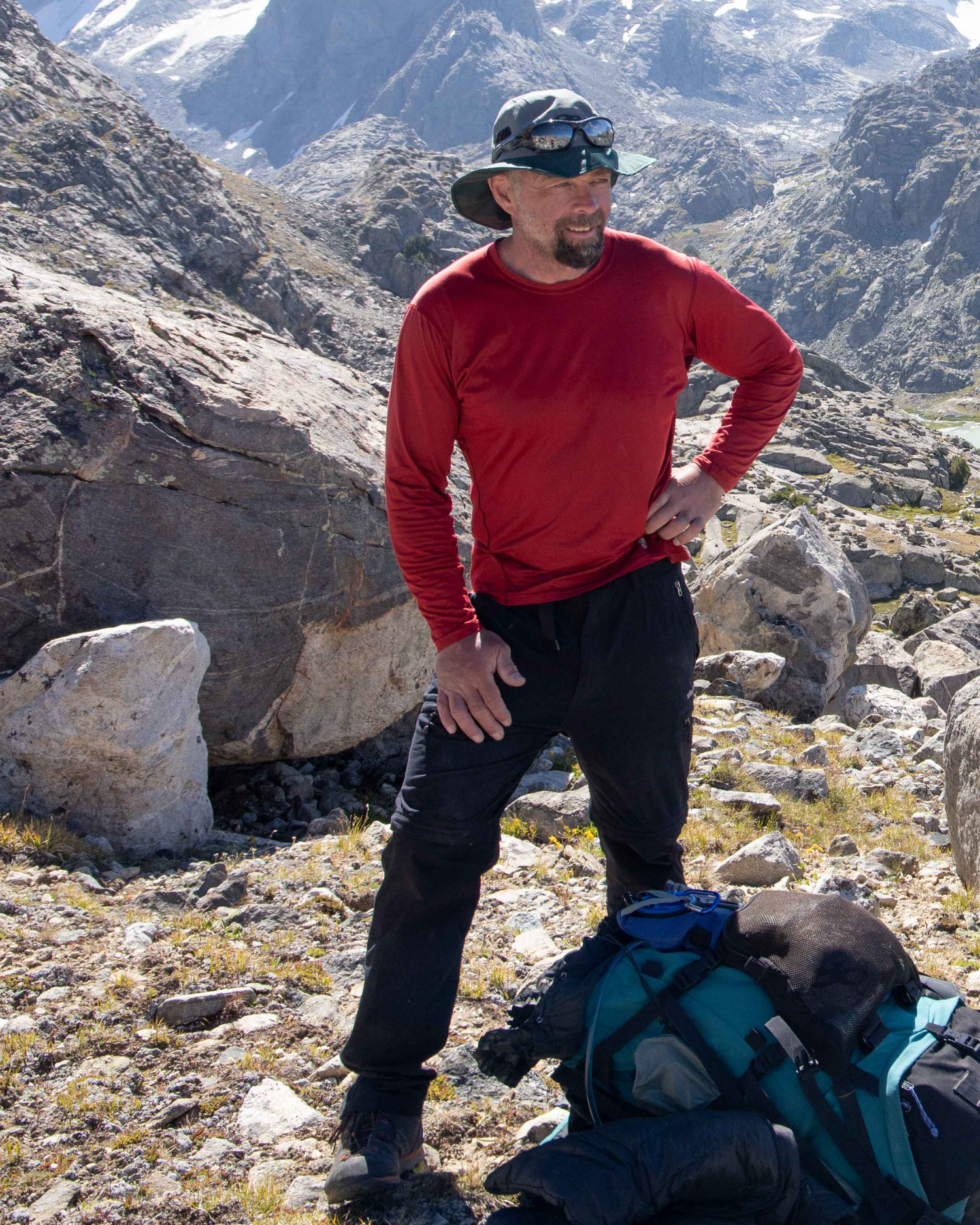 Trent, founder of Summit Strength, standing full-length on a ridge in the Wind River Range